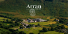 Arran distillery surrounded by green hills with Arran logo overlay